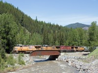 This train just departed Sparwood after a quick inspection after some of the cars set off a defect detector further down the line. Ended up being a defective defect detector. Train was allowed to proceed to Crownest. Here it is crossing Michel Creek with 3 UP engines in the consist. UP run through engines common in this part. 