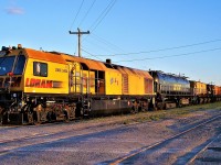 LORAM consist passing through the east end of Agincourt's car repair tracks.