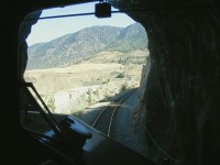 Exiting the tunnel at mile 168.4 on the BC Rail Lillooet sub as we continue our journey north on the Rocky Mountaineer Fraser Discovery from Whistler to Quesnel BC. This is on the infamous "Kelly Lake Hill" with a continuous grade 31 miles long, most of which is 2 percent.