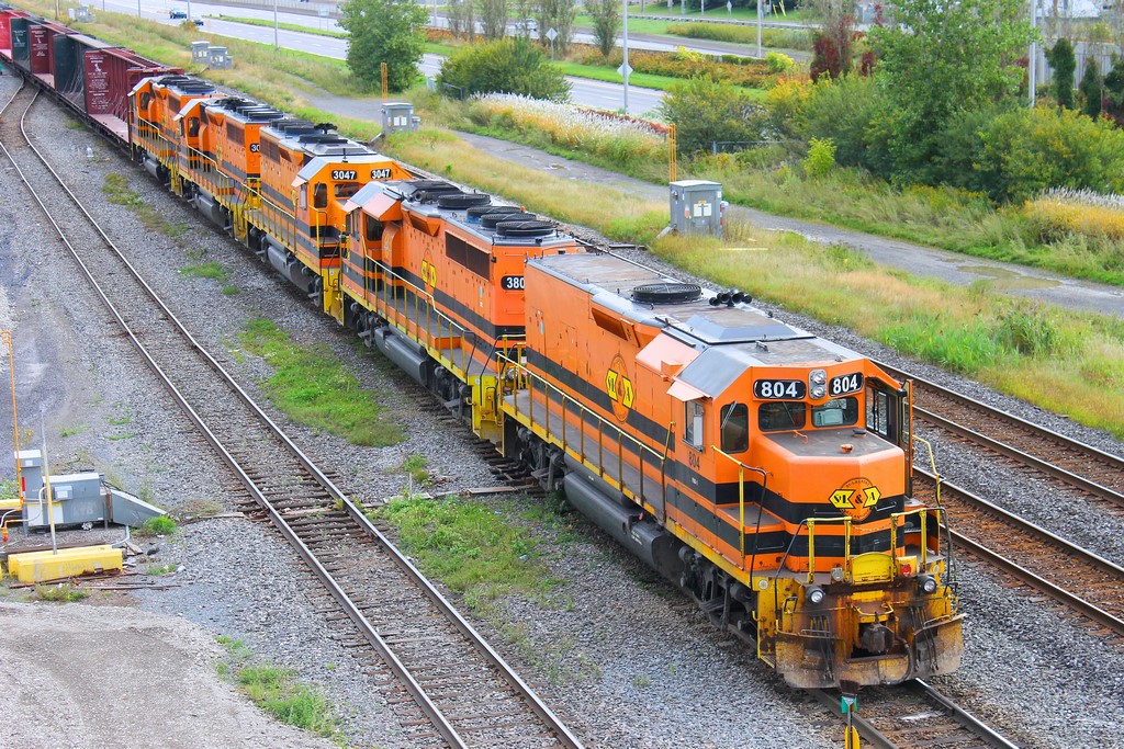 4 locos St-Lawrence & Atlantic 804-3804-3047-3008 and Québec & Gatineau 3105 pulling car in the Southwark yard on rte 393  this train droop cars in the yard and pick up others cars and go back on rte 394 to Sherbrooke and Richemond P.Q . photo from a gateway over tracks for me al emd GP 40