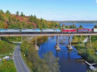 Central Maine & Quebec Job#1 is crossing Lac D'Argent at Eastman on a splendid September morning.