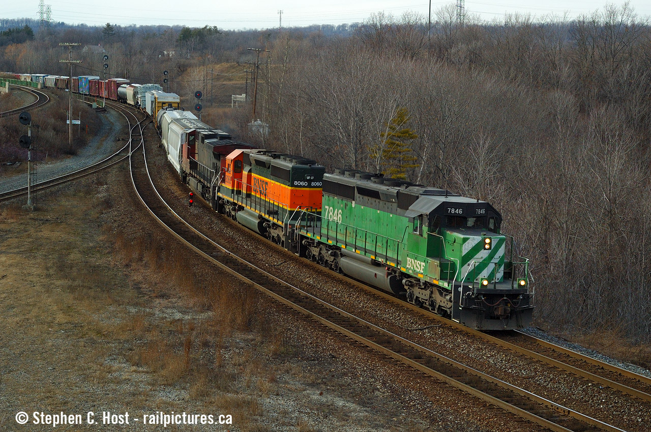 Earlier in the afternoon I shot a wicked (in retrospect) CN 435  and back then, it was just another CN powered train. Since the SD40-2's have become a real rarity on Canadian class 1's the power is now classic and highly sought after by fans. But it wasn't the catch of the day, heck I didn't even really note it as worthy of a mention. If you clicked the 435 shot link above and seen how many of us were out that day - there were tonnes of us out, it was that rich, good stuff every hour... and about two freight trains an hour to boot.

Arguably this M390 might not be the best train of the day (depends who you ask) but I'm really thrilled to have the SD40-2's - since they are in fact my favourite all time engine.  A pair of BNSF SD40-2's today is unheard of in run-through service, let alone leading. What has BNSF done to their sd40-2 fleet - any left? if yes, used on what? Please comment below, with thanks. I really don't spend time following the western railways so I just don't know the status of their roster. Cheers!