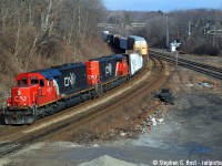 So Arnold's recent pic from Feb 2006 had me looking back to see where I was that day - Probably nursing a Hangover - I wasn't anywhere near Paris at that time of year. Here's my closest outing to Arnold's day. But do you kids REALLY want to know that THIS was mundane? From SMM who posted his report of what happened on this day to the FPON Yahoo Group (<a href=https://groups.yahoo.com/neo/groups/FPON/conversations/messages target=_blank> subscribe </a> to read, it's insane what went on back then!), and this list only notes the 'good' trains:<br><br>CN393 CN2557-UP9308 11:38<br>CN394 BNSF7819-BNSF984 11:50<br>CN148 CN5776-NS/CR4812-GCFX6077 12:34<br>CN411 CN5729-BNSF7856 14:25<br>CN278 BNSF868 14:56<br>CN390 BNSF7846-BNSF8060-CN2590 16:14 <br><br>I also managed to shoot CP 230 with STLH 5615 leading, 5687 trailing at 0800 and a CP Eastbound on the way home with 8700 and CEFX 139 (sd90mac in maroon) at Guelph Jct. <br><br>If anyone can note the train number of this westbound (12:56) , please comment if you can. Thanks!