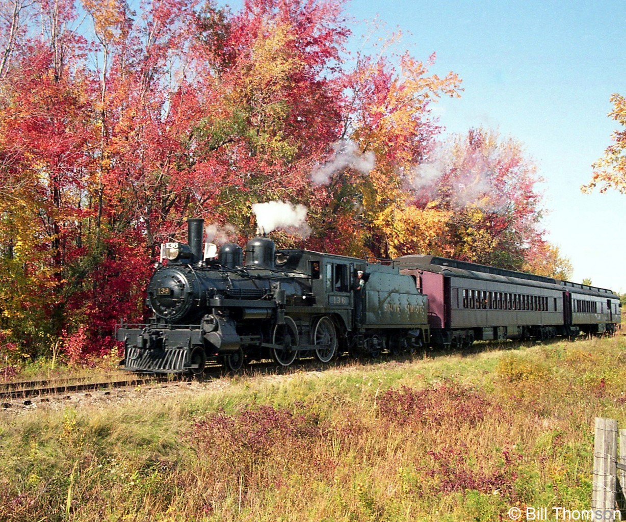 South Simco Railways's ex-CPR 4-4-0 136 hauls a pair of heavyweight passenger cars past the colourful foliage near Tottenham ON, in 1992.