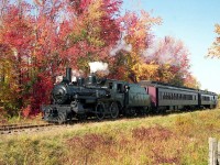 South Simcoe Railway's ex-CPR 4-4-0 136 hauls a pair of heavyweight passenger cars past the colourful foliage near Tottenham ON, in 1992.