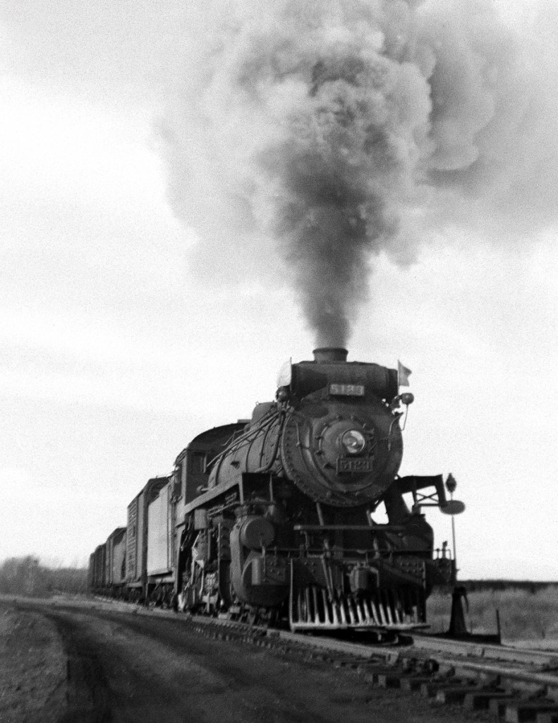 P1e 2-8-2 5123 returning from Brandon takes the east leg of the wye into the east yard on the Glenboro Sub. at Souris, an important terminal in the steam era