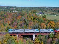 Hidden by growing vegetation over the years, Central Maine & Quebec Job #1 is crossing the bridge at Stukely on a pleasant September morning