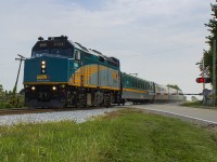 On a quiet Sunday morning, Train 71 hustles across the Tecumseh Line on it's approach to Jeanette's Creek.