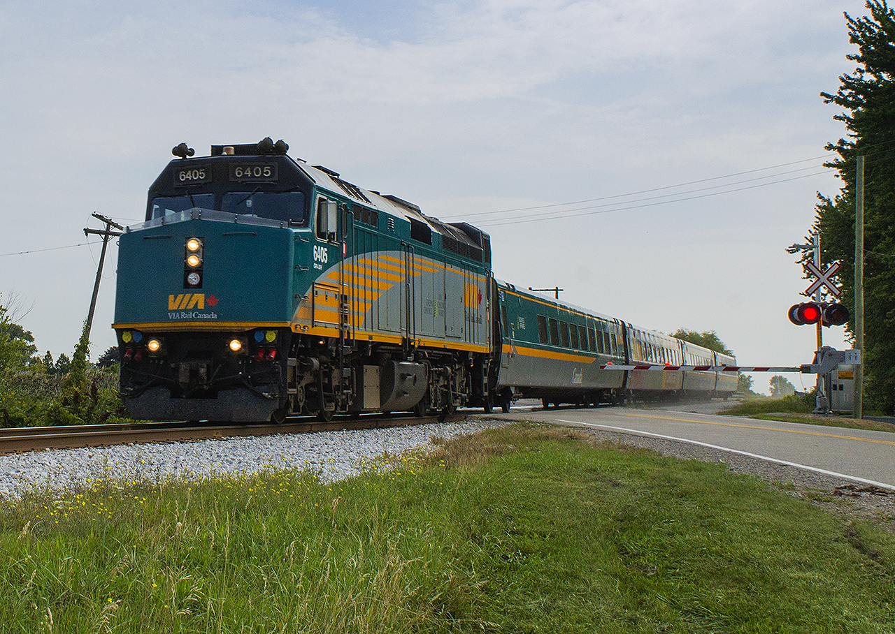 On a quiet Sunday morning, Train 71 hustles across the Tecumseh Line on it's approach to Jeanette's Creek.