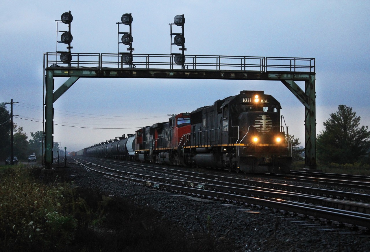 CN 434 makes it's way past Paris after meeting a WB mixed freight seconds before