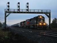 CN 434 makes it's way past Paris after meeting a WB mixed freight seconds before