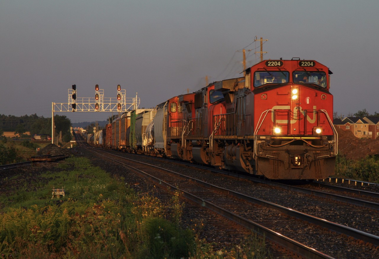 In blinding morning light, a late 398 rolls through Mount Pleasant, soon approaching its destination of Mac Yard.