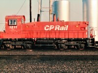 Parked by Agincourt's old diesel fuel storage tanks is rebuilt SW1200RSr. The yellow/black decals on the carbody indicated that the unit was equipped with a auto start/stop system to save fuel.