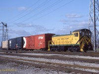  Essex Terminal S-1 101 has three cars in tow including CP202327, a half plug door/half sliding door 50' XM box and an N&W Box both with no graffiti and a load of lumber by the old approach signal for Lakeshore Jct. 