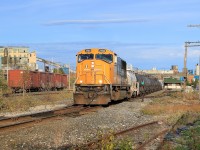 ONT 2104 is working solo today as it pushes back a long cut of tank cars into Glencore's Horne Smelter complex.  The cars are headed over to the acid plant where they will be filled with sulphuric acid that is produced during the copper smelting process.  To the right is the old Noranda station, built circa 1925.