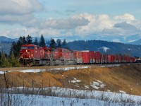 A westbound mixed freight is climbing towards Notch Hill on the north track.