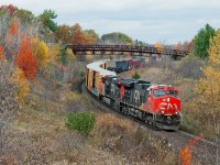 A bit late to the fall colour party, CN 435 rolls downhill with 10,827 ft of traffic bound for Oakville/Aldershot, Brantford, London and Windsor behind two GE's.
