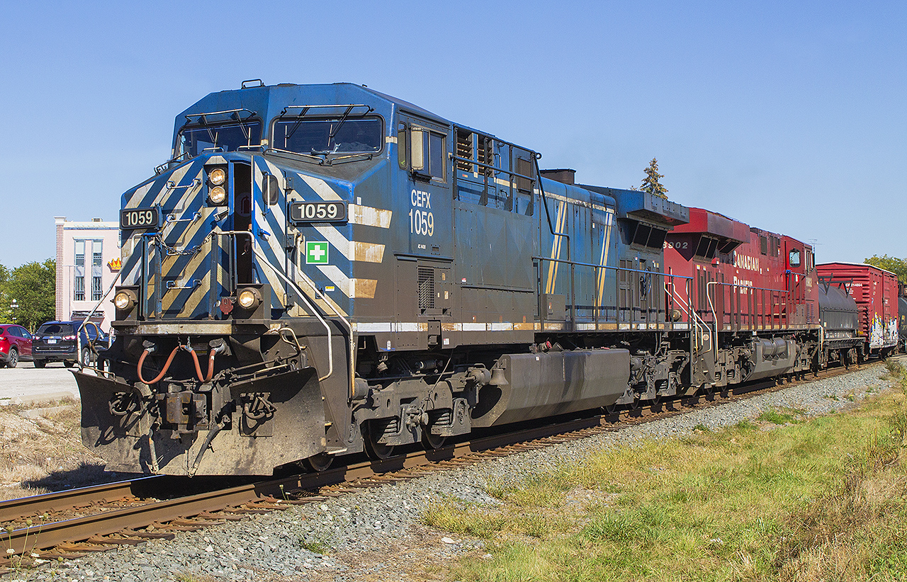 Sometimes you just get lucky enough, like capturing a slow rolling westbound freight on my lunch break. I am sure that the cab door on CEFX 1059 was providing enough of a breezeway for the crew during a particularly warm spell during October. Trailing is CP ES44AC 8902.