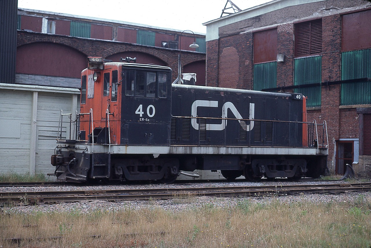Out back of PEI's CN diesel shop when I stopped in to check out the facilities was old CN #40, a 600 HP 70-Tonner. This must have been about the end for her, as I not only could not find out what eventually happened to her, but it was hard enough even to find a photo. With a boarded up window, a pilfered lamp and the stack capped; I guess she was on her last legs and probably ended up somewhere at a scrapper. But would like to know for sure. The demise of this unit left only 30, 35 and 41 operating. And their days were very numbered.