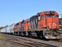 CN L55031 09 with CN 4125, CN 7068, and CN 4710 shoving on the tail end of CN M38531 09. 385 has CN 8853, BCOL 4613, and CN 2426 up front with 174 cars