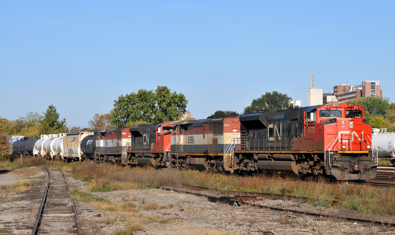 Double the consist!

CN 8872, BCOL 4607, CN 8879, and BCOL 4620, lead CN M39491 18 through Brantford with 157 cars in tow
