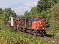 CN A435 takes the approach to Mansewood "with the arrow" as it rounds the bend on an August afternoon that couldn't have cooperated better for us, it poured rain between trains but every time one was near the sun would break through just in time for photos. 