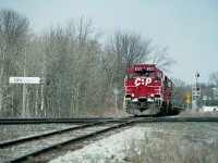 This was one of those delightfully crisp bright sunny, almost blinding, days that only the early spring can provide. And it was a good day to be down by the ole diamond, CN Carew, in Woodstock to catch CP 8222 and 8219 running a westbound train along the St. Thomas sub, about to cross the CN Dundas sub. The line is yet a few years off being handed over to the Ontario Southland. Otherwise, not much has changed at this location except that it is now off limits to us photographers.