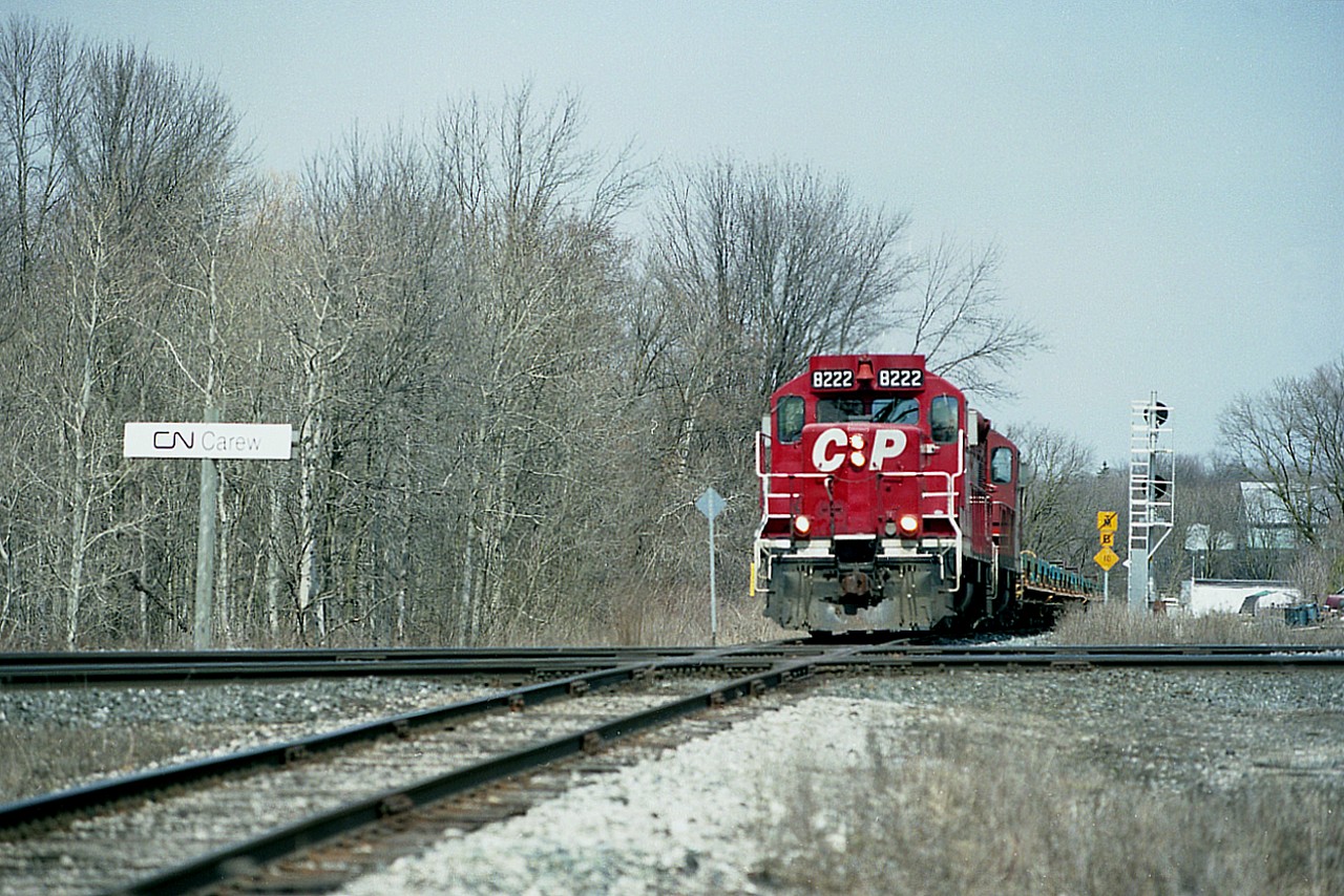 This was one of those delightfully crisp bright sunny, almost blinding, days that only the early spring can provide.  And it was a good day to be down by the ole diamond, CN Carew, in Woodstock to catch CP 8222 and 8219 running a westbound train along the St. Thomas sub, about to cross the CN Dundas sub.  The line is yet a few years off being handed over to the Ontario Southland. Otherwise, not much has changed at this location except that it is now off limits to us photographers.