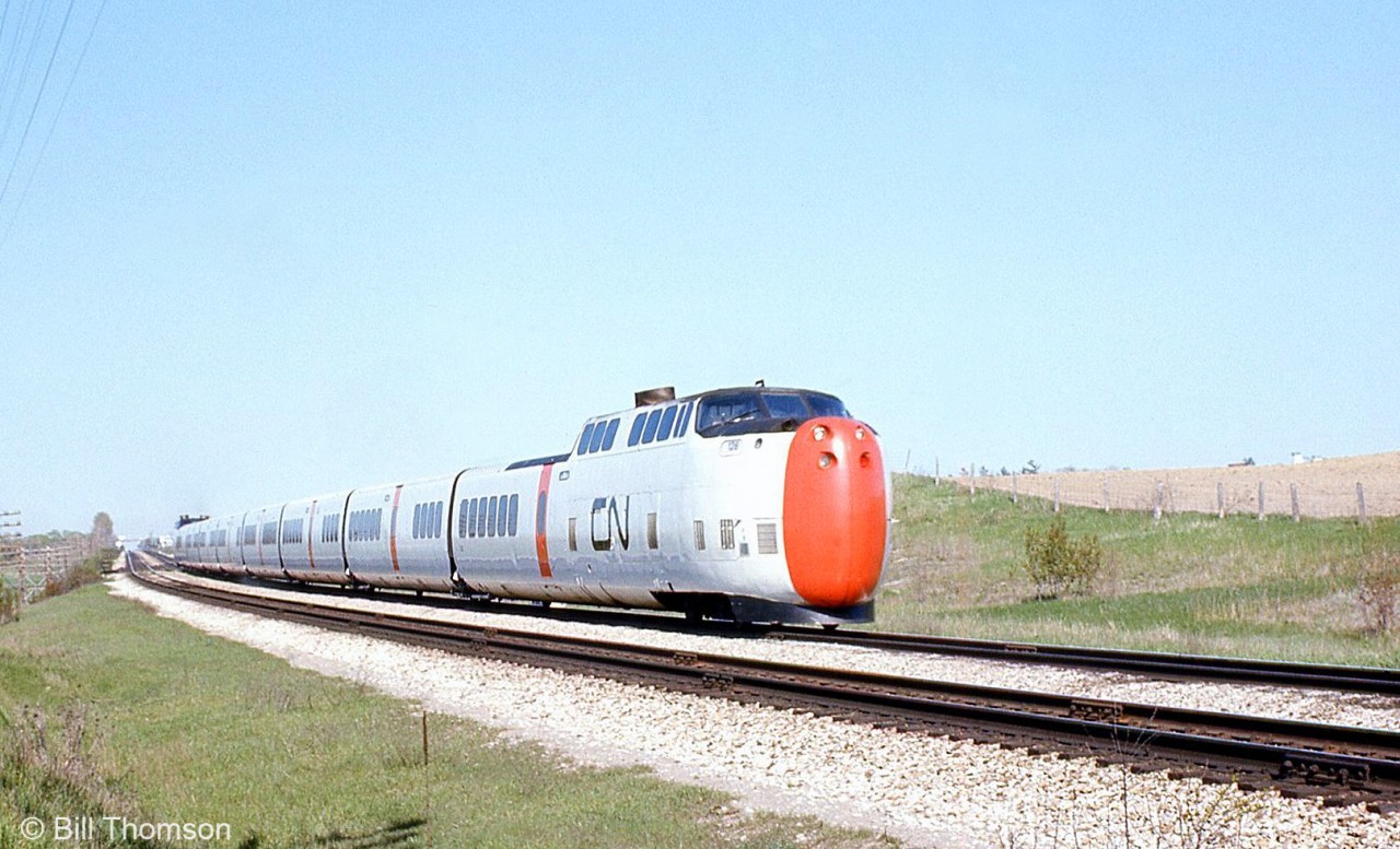 One of CN's Turbo Trains is pictured heading westbound on the Kingston Sub at Pickering in June 1974. When CN introduced the Turbo they ran a press train between Toronto and Montreal to show off their latest and greatest on December 10th 1968. Unfortunately at Kingston (Division St. crossing) it hit a meat delivery truck - there were no injuries but it spoiled the show.