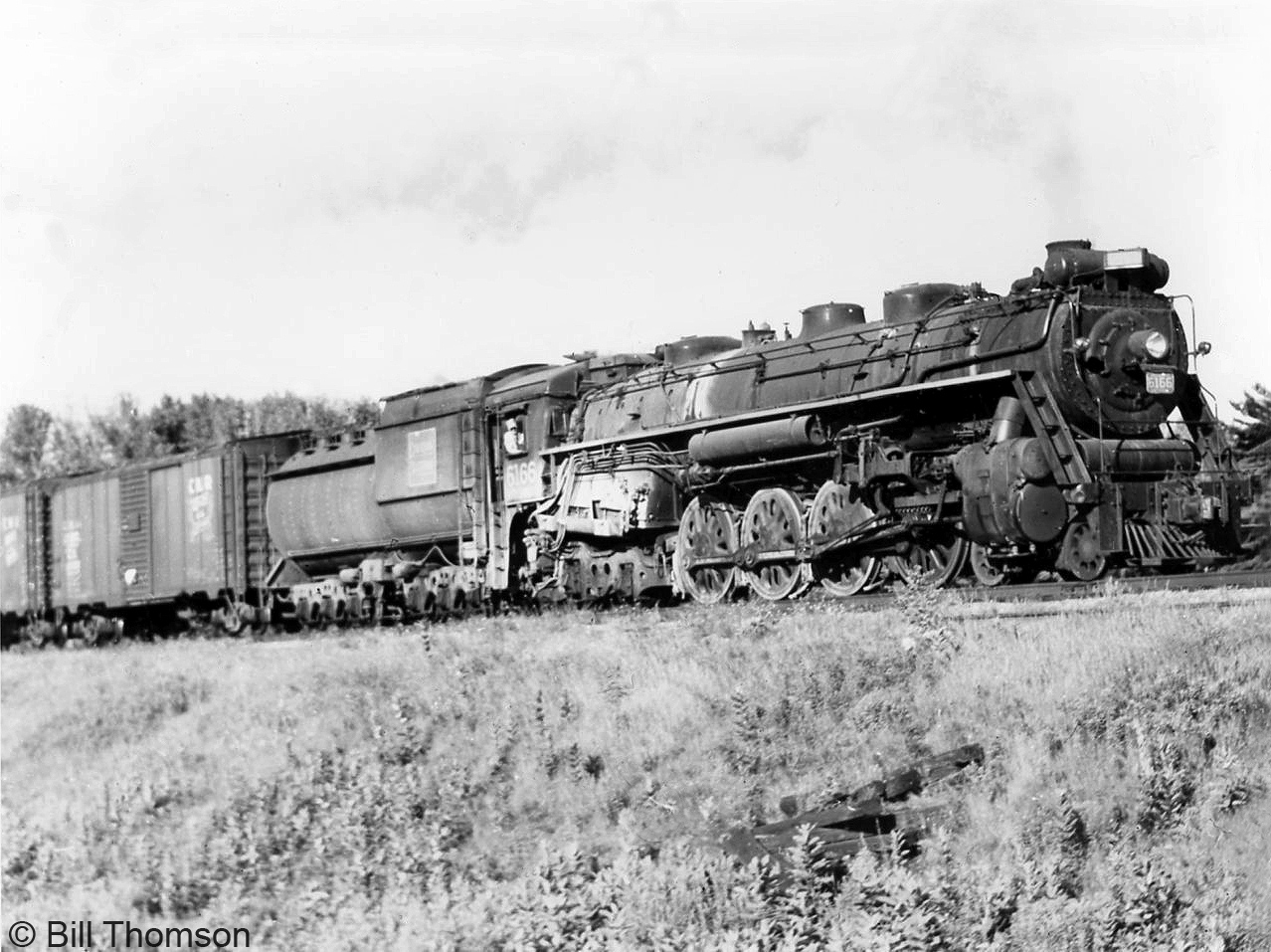 CN 4-8-4 Northern 6166 heads a westbought freight through Port Credit in 1956. Built by MLW in 1940 as part of the U2e class of Northerns (6165-6179), she would be retired and scrapped a few years later in 1959.