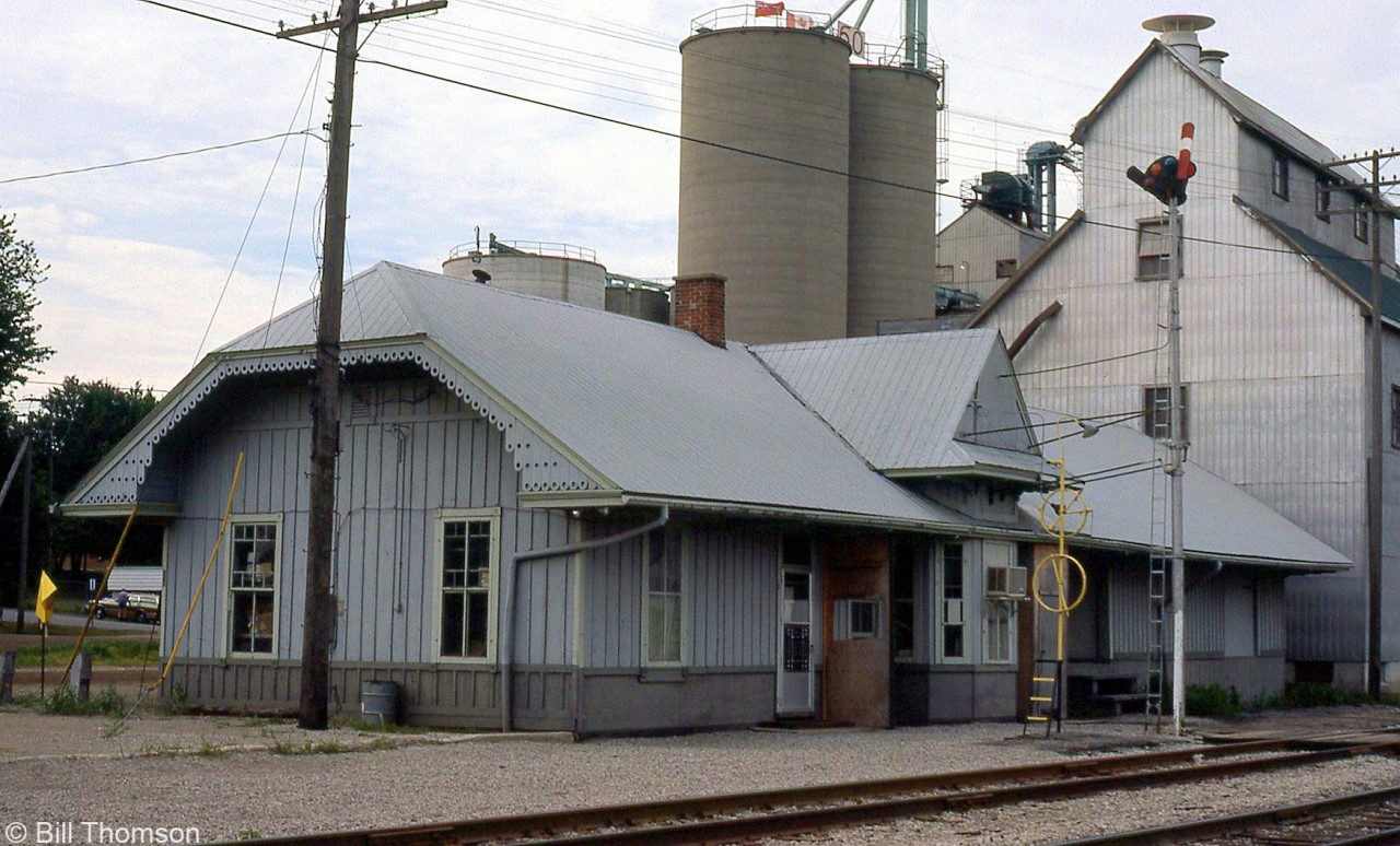The Chesapeake & Ohio's Blenheim station is pictured on July 26th 1984, tucked in beside Taylor Grain & Feeds.