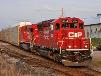 CP SD30C-ECO 5024, and recently repainted AC4400CW 9817, lead 147 through Ayr, ON with 37 autoracks in tow