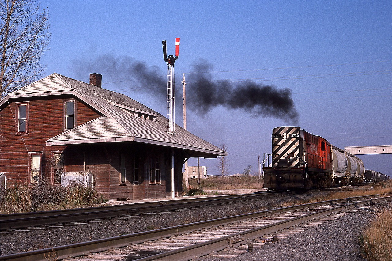 Nice looking afternoon back at the end of October 1979 as CP 8730, an RS-18, works a cut of cars at the Canada Cement (Lafarge)siding at Zorra Station. Pity the station has been gone more than 30 years. It made a nice prop for smokey MLW images back in the day...........
