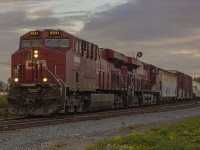 Early mornings can equal great opportunities. The weather was perfect. The sun was just starting to rise, but there was still enough cloud cover that it illuminated the sky. Keeping myself occupied, with time to kill before work I was driving around hoping for a break. I came across the tracks by the ethanol plant, and to the west I saw a trio of eastbound headlights coming my way. With no time to spare I pulled into CP's access path, put the car in park and hopped out with camera in my hand. At this point, the crossing lights had been triggered, and the gates were lowering so I knew I had very little time to setup for this shot. Despite the lack of time, I was able to snag this shot of CP 8931 & 8943 passing the sidings at Bloomfield Road on it's approach into Chatham.
