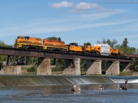 The special HEPX move slowly crawls across the Grand River in Caledonia with RLHH 3049 and RLHH 3404 on the point.