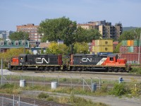 A pair of GP9's (CN 7075 & CN 7032) with noodles of varying size on their long hoods work the Pointe St-Charles Yard.