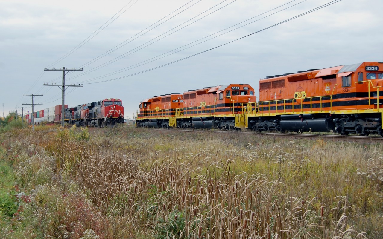 Here is a CN 901 (QGRY Detour train) due to a wreck bridge on the QGRY Main line on Montreal north shore. The Cn 901 was sitting on the siding to wait a meet with CN 120 at Saint-Apollinaire on the Drummondville Subdivsion. This is a rare sight of a QGRY train on CN tracks.