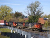 CN 120 has three EMD's up front (CN 8016, CN 5680 & CN 8919) with a fourth mid-train (CN 8851) as it passes the railfans park and the entrance to the RTM's maintenance centre.