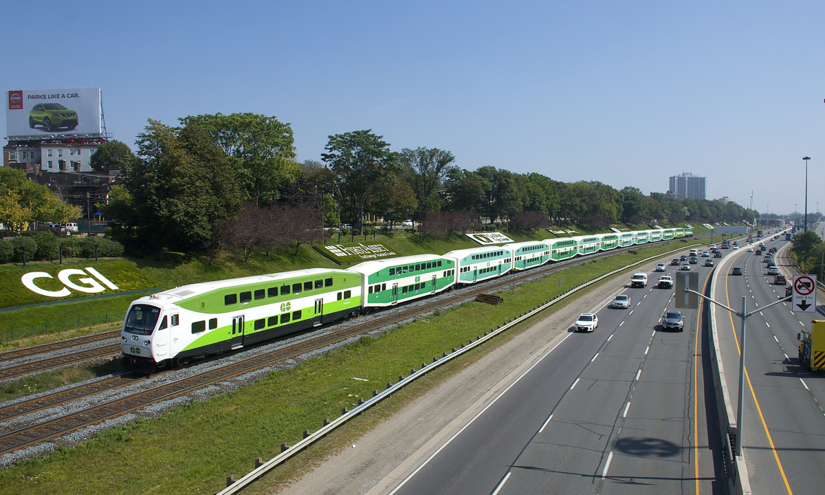Fairly new cab car GOT 354 leads a 12-car train westbound along the Oakville Sub.