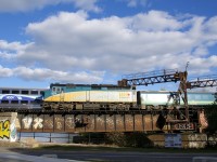 Both AMT 814 and VIA 37 are crossing the Lachine Canal after leaving Central Station more or less simultaneously. VIA 37 has VIA 6415 pushing the train as it backs out, in not too long the train will change directions and head towards Ottawa.