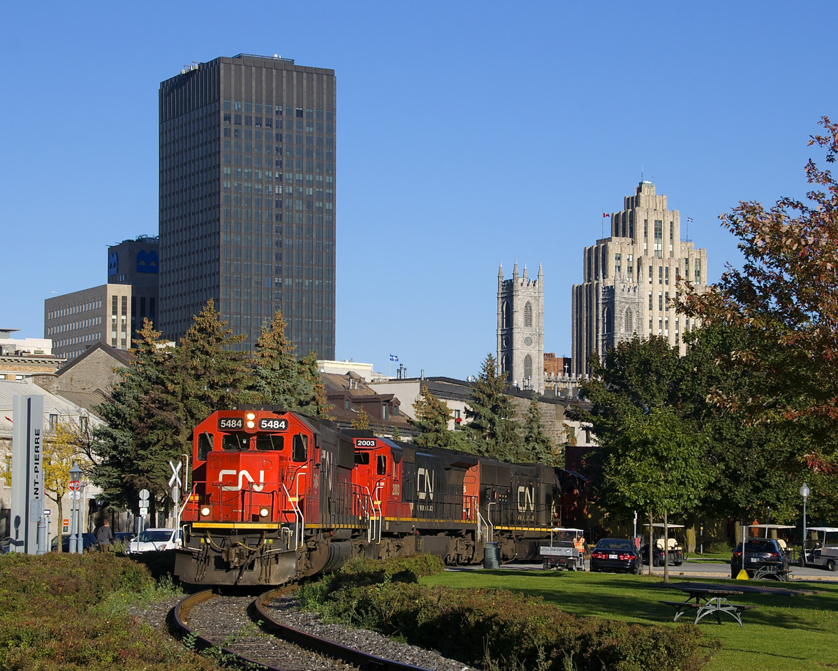 Standard cabs SD60 CN 5484 and Dash8-40C CN 2003 (along with wide cab SD75I CN 5778) are the power on CN 149 as it leaves the Port of Montreal with intermodal tonnage for Toronto and Chicago.