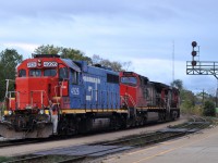 CN 2523, CN 2589, and GTW 4926 backing on to their train of 61 cars, after setting off CN 4114 for use on 580.