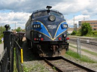 SHERBROOKE SCENE. The gates have been opened to allow FL9 # 484 to lead the Orford Express to Magog on the beautiful afternoon of August 11, 2013. Behind this 1957 vintage diesel, which once saw service with the New Haven Railroad, Amtrak and others, some of the 212 passengers to travel that day are still embarking for a delightful ride and meal through the Eastern Townships. Upon arrival in Magog, the FL9 will be the trailing unit as M420TR # 26 (see image 29463) will take the Orford Express back to Sherbrooke. Travelling there to watch their youngest son Thomas represent Newfoundland and Labrador in the sport of soccer during the 2013 Canada Games, it allowed this railfan and his wife Michelle to experience not only one of North America's most beautiful tourist trains but also one of their most memorable dining experiences anywhere on the entire continent. It also gave them an unexpected opportunity to retrace some of the same rails they rode 25 years earlier on VIA Rail's 'Atlantic' en route to Montreal, one of the many 'named' trains they experienced during their month-long cross country rail trip. 