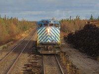 "JUST GOT IN FROM WAY UP NORTH". The lyrics to Blue Rodeo's 'Bad Timing' came immediately to mind at Emeril Junction on October 16, 2014. As seen from the cab of QNS&L 516, Tshiuten Rail GP38-2W No.701 takes the southbound passenger train to the siding at Emeril while en route to Sept-Iles from Schefferville. Created in December 2005 in an agreement with QNS&L and the First Nations, Tshiuetin Rail Transportation Inc. (TSH) is a shortline that stretches 134 miles (217 kilometres) through the wilderness of western Labrador and northeastern Quebec, It connects Emeril Junction Labrador with Schefferville, QC on the interprovincial boundary. Immediately behind the lead unit is Engine 702 trailing several pieces of ex-Amtrak passenger equipment on one of the most northerly lines anywhere on the continent.
