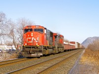 CN 5635 & CN 2615 lead CN 309 on the north track of CN's St-Hyacinthe Sub on a sunny afternoon during the winter of 2009.
