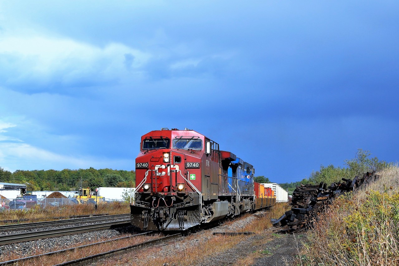 Heavy rain had just moved through and the sun poked out to the west as CP 246, with CP 9740 and CEFX 1052 for power, approached Guelph Junction to began its southward journey down the Hamilton sub.