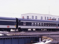 RECENTLY REFURBISHED. Terra Transport baggage car 1308 and coach 764 are captured just prior to the departure of Mixed Extra 935 West at Bishops Falls, Newfoundland on April 16, 1988. Having been taken out of service for the prior 3 months following a CTC ruling that saw the mixed cancelled for the winter months, it and the baggage car were restored to pristine condition by the TT Shops in St. John's. With an imminent but not yet confirmed closure, the turntable in the foreground was now in the locked position. Built in 1949 by the Canadian Car and Foundry as coach No. 47 for the Newfoundland Railway and later renumbered 764 under the CNR, it survived the shutdown of the narrow gauge system in September of that year and now makes a wonderful addition to the permanent display at the Lewisporte Train Park.