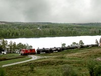 The last remaining segment of CPR's Maritime operations, the McCain spur from St.Leonard to McCain plant at Grand Falls NB, sees RS23 8019 heading east along the St.John River to the McCain plant. The line was sold to CN later that year and now abandoned