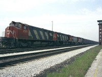 This location is known to the fans these days as the VIA Rail Maintenance facility/Willowbrook, near where also Toronto and GO facilites are located. However, before that, this was the location of that sprawling CN Mimico freight yard, a facility that eventually outgrew itself and was relocated to what is now MacMillan Yard up in Concord. The Mimico days were winding down around the time I shot this image of eastbound CN with three M420s and what looks to be a GP40 with a long string of boxcars passing the Tower. A modern day shot at this angle would be overshadowed by the Islington Av overpass, which would be not far behind the tower. I get the idea that this must have been one 'sooty' place back in the days of Steam. :o)