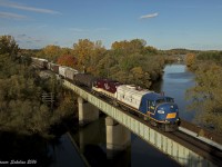 Ontario Southland's Woodstock Job backs over the Thames River Bridge at Woodstock Ontario.